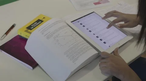 Student uses iPad to study and check social media at university college Stock Footage 46264923
