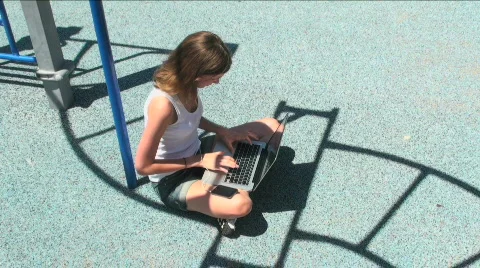 Student Uses Laptop At Playground Stock Footage