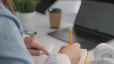 The student uses technology to actively learn and develop her creative abilities Stock Footage 263153482