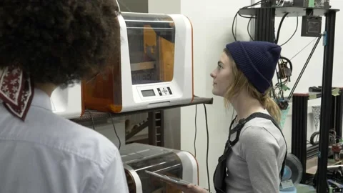 Student using 3d printer in college Stock Footage 220467925