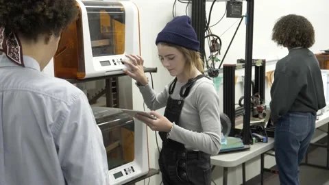 Student using 3d printer in college Stock Footage 220467932