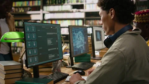 Student using AI brain on desktop and studying in library computer class Stock Footage 337228951