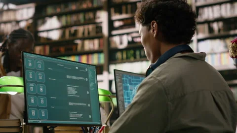 Student using AI brain on desktop and studying in library computer class Stock Footage 337230896