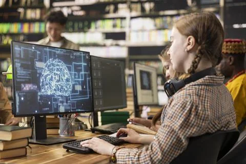 Student using AI brain on desktop and studying in library computer class Fotos Stock