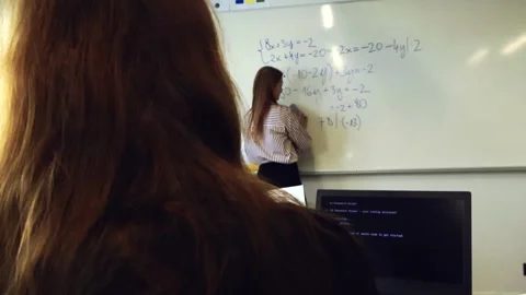 Student using AI to solve math problems during class Stock Footage 346596810