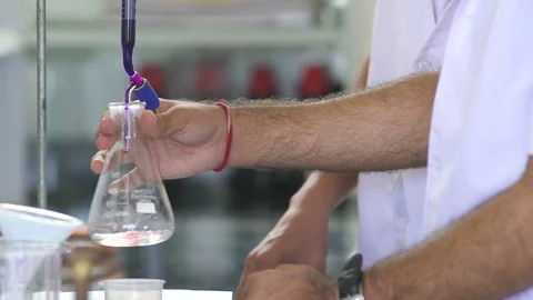 Student Using Burette Pipette in Science Lab in Science Lab 動画素材 90746482