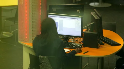 Student Using Computer with Blur in foreground Stock Footage 61636324