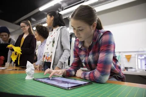 Student using digital tablet in 3d printing workshop Stock Photos