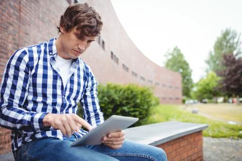 Student using digital tablet in campus 스톡 사진