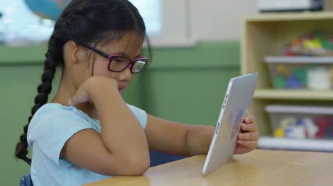 Student using digital tablet in school classroom Stock Footage