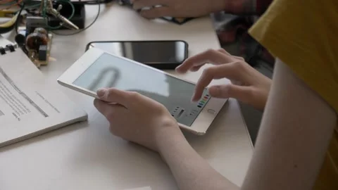 Student using digital tablet in technology workshop Stock Footage 220467887