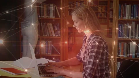 Student using her laptop in library surrounded by data connections Stock Footage 104954999