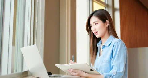 Student using laptop at home Video stock 128207226