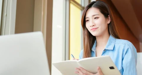 Student using laptop at home Stock Footage 128497450