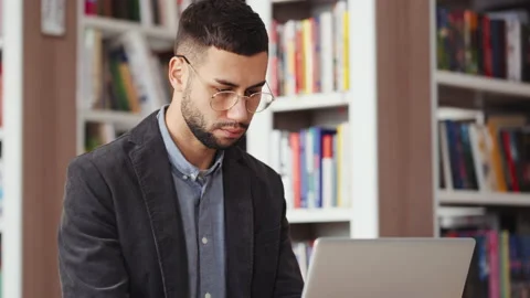 Student using laptop in library for scientific research Stock Footage 171524918