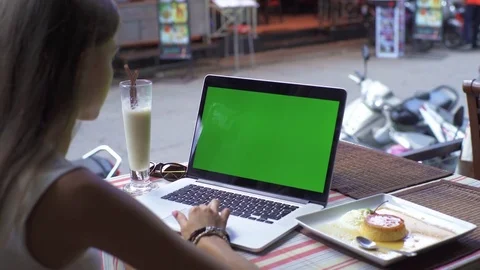 Student Using Laptop While Sitting At Cafe Stock Footage 70725159