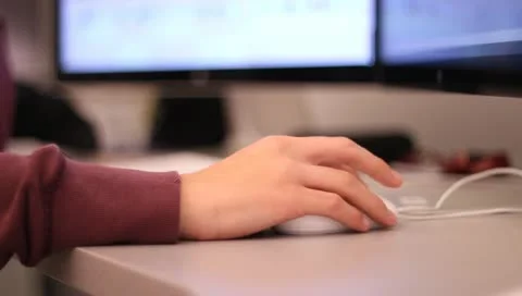 Student using macintosh mouse and computer Stock-Footage 10728246