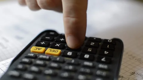 Student using pencil and calculator for math homework. math study. Video stock 223132651