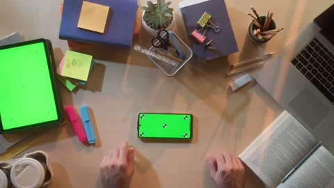 Student using smartphone with chroma key screen top view. Business person Stock Footage 168126758