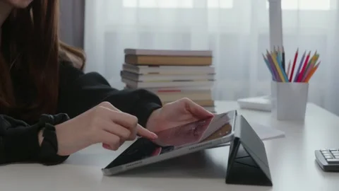 Student using tablet for online education at home Stock Footage 321935284