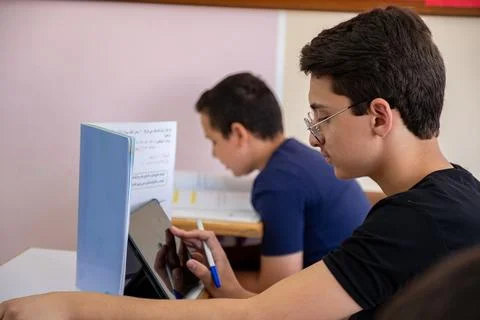Student using tablet in studying in class room Stock Photos