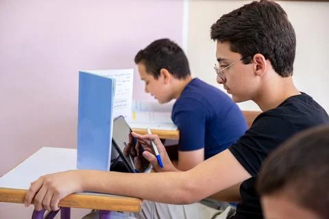 Student using tablet in studying in class room Stock Photos