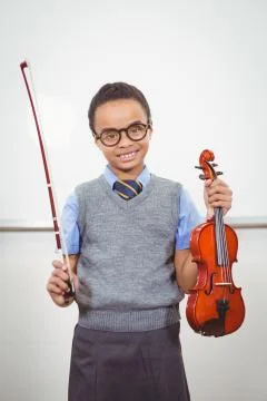 Student using a violin in class Foto stock