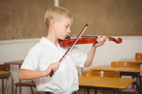 Student using a violin in class 스톡 사진