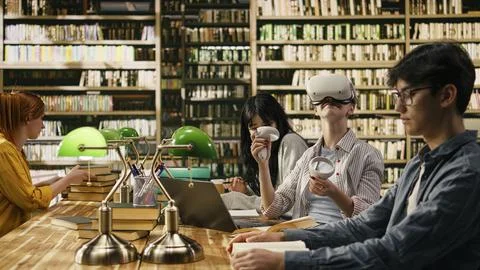 Student using VR device and controller to explore immersive learning Stock Photos