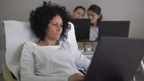 Student video conference e-learning with teacher on computer in living room Stock Footage 128063540