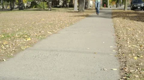Student walking on college campus Stock Footage 8839042