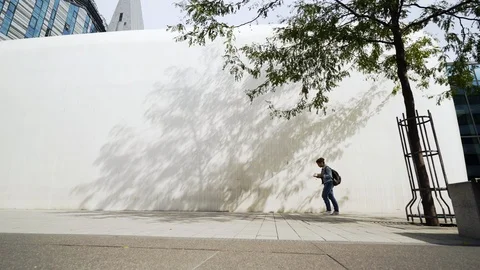 Student walking in internal campus modern university Stock Footage 100452731
