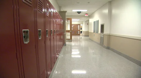 Student Walking Past Row of Lockers Stock Footage 37915337