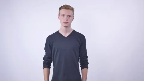 Student wearing a backpack on a white background Stock Footage 70566930