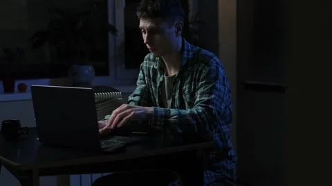Student while studying for exams fell asleep at night on desk with cup of coffee Stock Footage 297188523