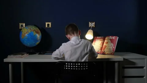 Student in white uniform doing homework Vidéo 169307481