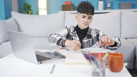 The student whose eyes get tired while studying wears glasses. Stock Footage 236226278