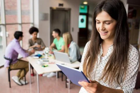 Student working on assignment with tablet Foto stock