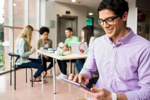 Student working on assignment with tablet Foto stock