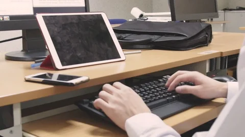 A student working on a class project in the computer lab Stock Footage 98304731