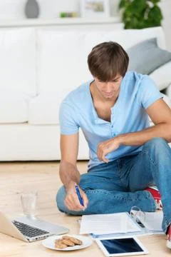 Student working at home on documents Stock Photos