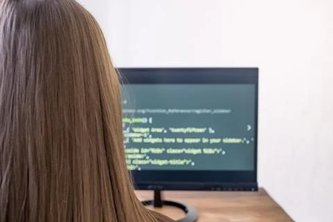 A student working at home using the computer, watching the screen. Close-up r Stockfoto's