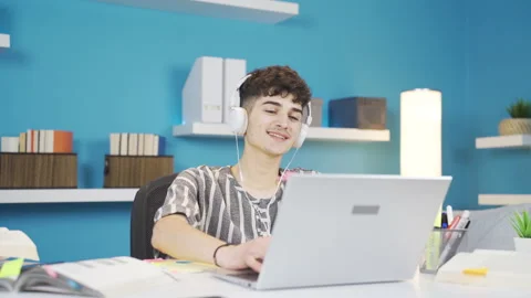 Student working on laptop dancing and singing. Stock Footage 237039812