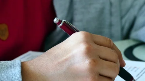 A student working at the lesson, solves the test question, Video stock 119124539