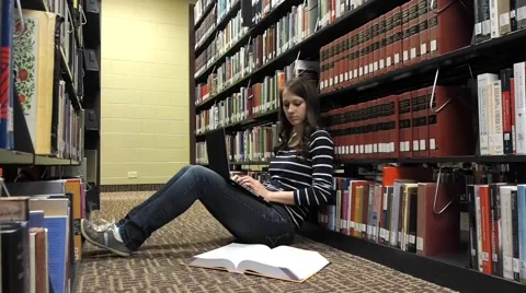 Student working in the library Stock Footage 46947759
