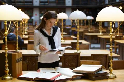 Student working in library Stock Photos