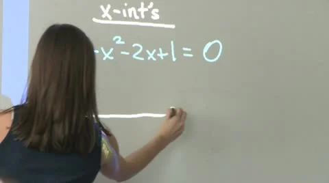 Student working on math problem on board in front of classroom (1 of 2) Stock Footage 10332557