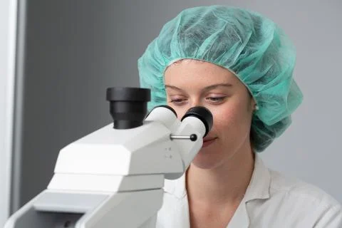 Student working at micrscope 스톡 사진