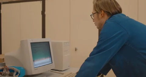 Student working on an old PC Stock Footage 97958455
