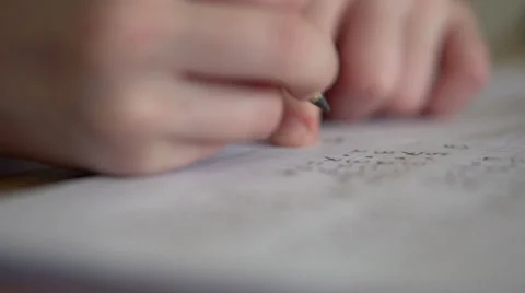 Student working out math problem with pencil Stock Footage 37592654